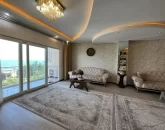 پذیرایی و نشیمن تمام شیشه آپارتمان 120 متری در تایباد 645341541531