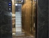 آسانسور مدرن و سقف طرحدار نورپردازی شده آپارتمان در مشهد 8569562