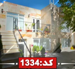 نمای ساختمان سنگی و پله های سنگی و حیاط محوطه سازی شده خانه ویلایی در قوچان 5449866