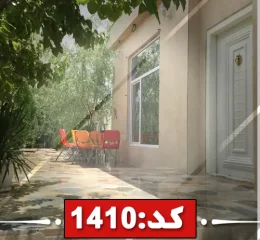 محوطه سرسبز با نمای سنگی خانه ویلایی در مشهد 484546