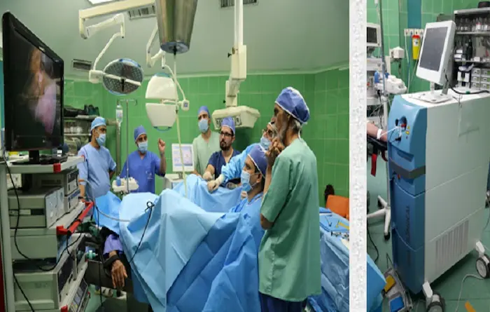 جمعی از دکتر ها در اتاق جراحی با دستگاه لیزر در بیمارستان فارابی مشهد 41581456